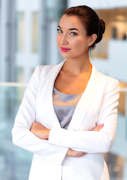 Pretty business woman in an office - Photo, Image