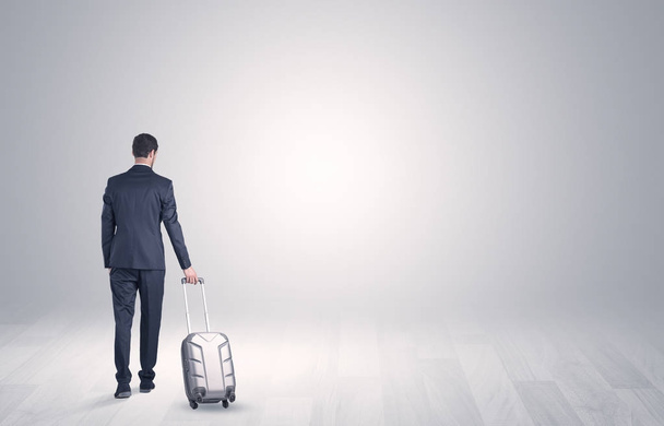 Business with luggage in a boundless space - Foto, Imagem