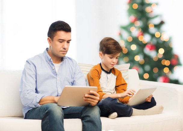father and son with tablet pc at christmas - Photo, image