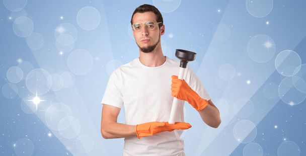 Glittered background with male housekeeper - 写真・画像