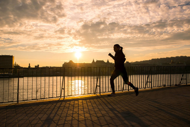 Young woman running in sunset	 - Fotó, kép
