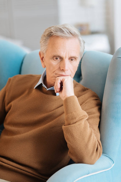 Upset elderly man thinking about something - Foto, Imagen