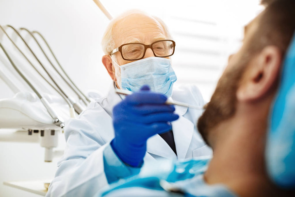 Close up of professional dentist with a mask - Photo, Image