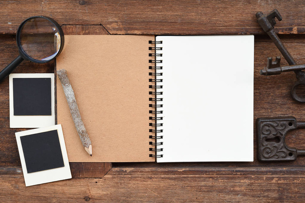 Blank notebook with pencil and magnifying glass  - Foto, imagen