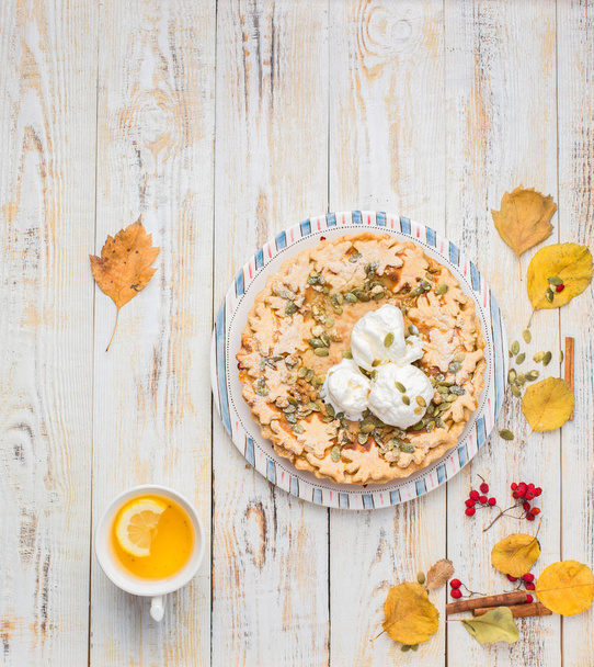 Autumn background with pumpkin pie with ice cream - Photo, Image