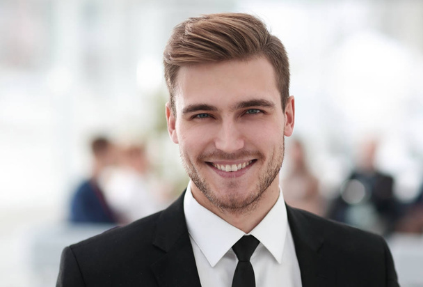 portrait of confident young businessman on blurred background. - Photo, image
