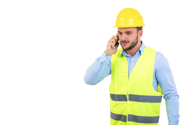 Angry upset young construction engineer yeling at the phone - Foto, Imagem