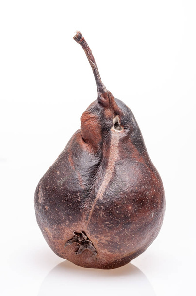 Wrinkled and rotten brown pear isolated - Fotografie, Obrázek