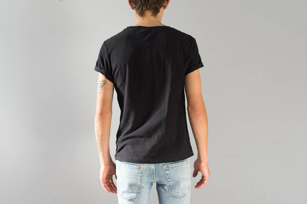 Young man in black mockup tshirt - Фото, зображення