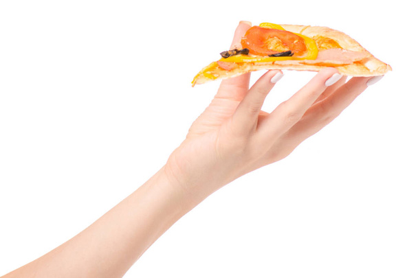 Pizza piece in hand - Фото, изображение
