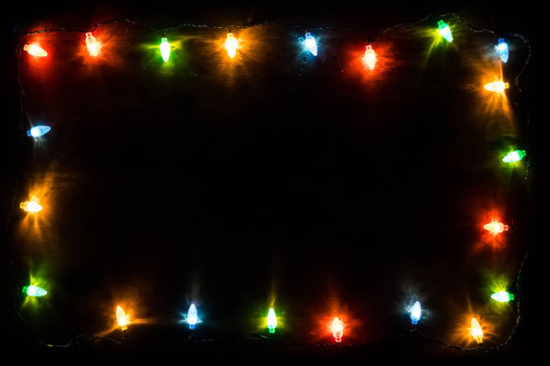 christmas garland lights on blue wooden background - Photo, Image
