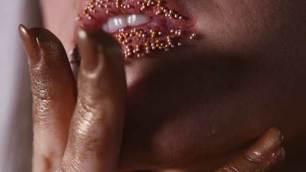 confetti on the lips, beautiful make up and bright colorer of lips - Materiał filmowy, wideo