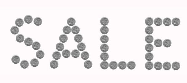The word "sale" of coins isolated on white - Photo, Image