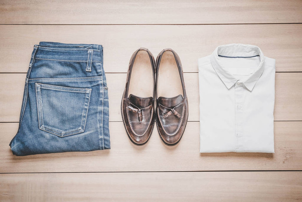 Clothing for men on the wooden background - Photo, Image
