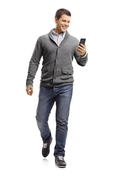 guy using a phone and walking  - Photo, image