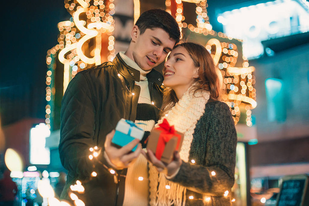 romantic surprise for Christmas, woman receives a gift from her boyfriend - 写真・画像