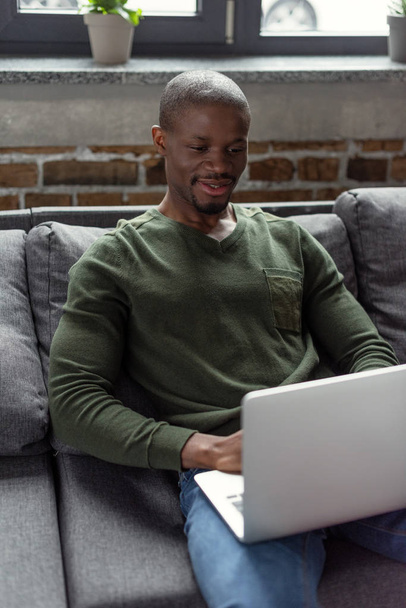 african american man typing on laptop - Foto, Bild