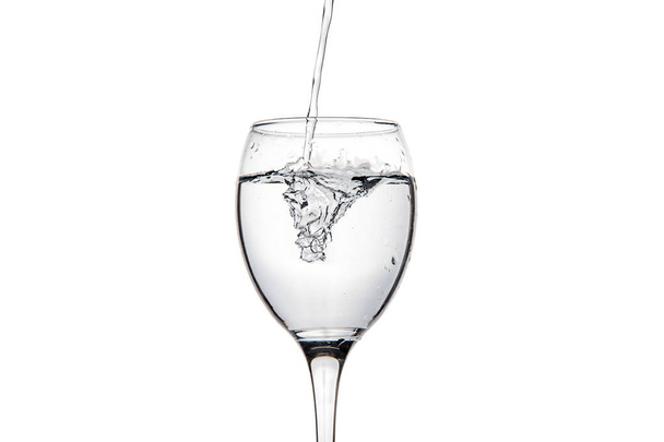 Wineglass with splashing drops of fresh water - Φωτογραφία, εικόνα