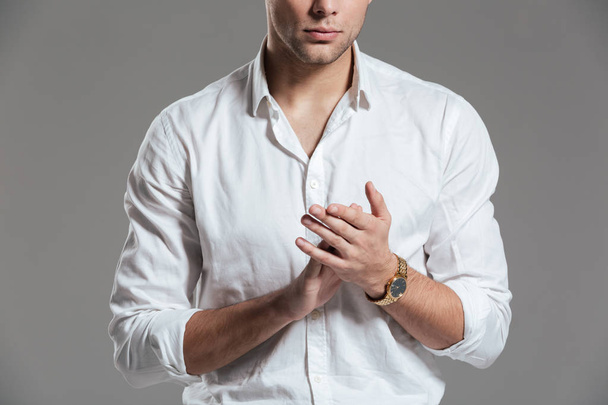 Close up of a young man dressed in white shirt - Foto, afbeelding