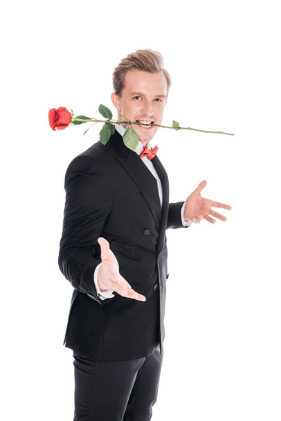 stylish man with rose in teeth - Fotoğraf, Görsel