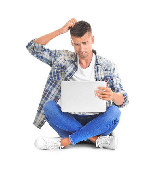 Young man with laptop   - Foto, afbeelding