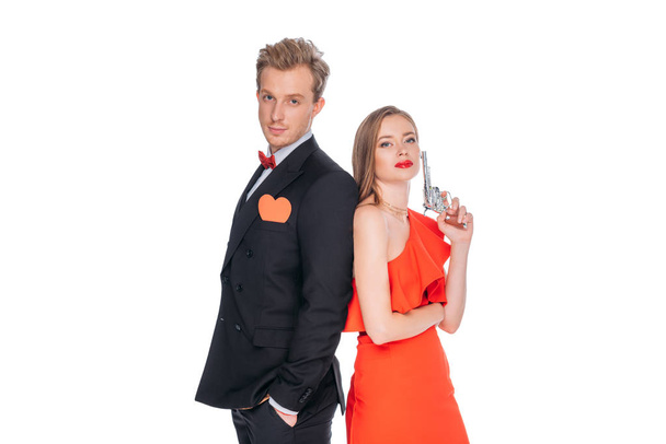 young couple with revolver - Zdjęcie, obraz