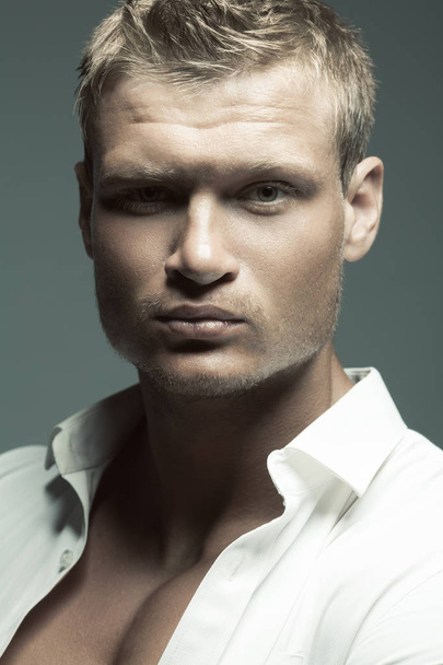 Male fashion, beauty concept. Portrait of brutal young man - Foto, afbeelding