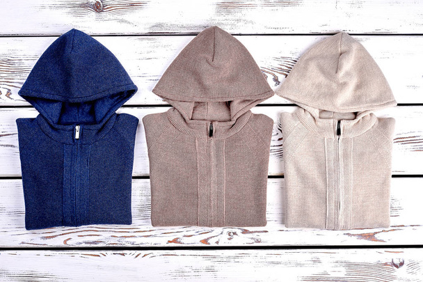 New hooded sweaters, top view. - Photo, Image