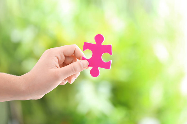 Woman holding piece of puzzle  - Photo, Image