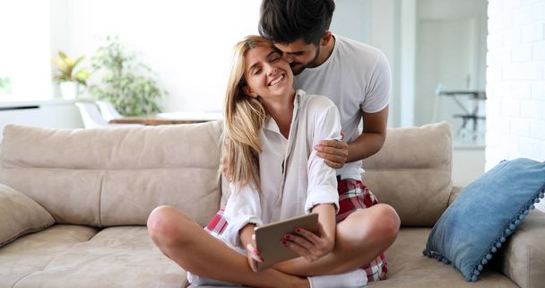 Cute couple relaxing on couch - Foto, imagen
