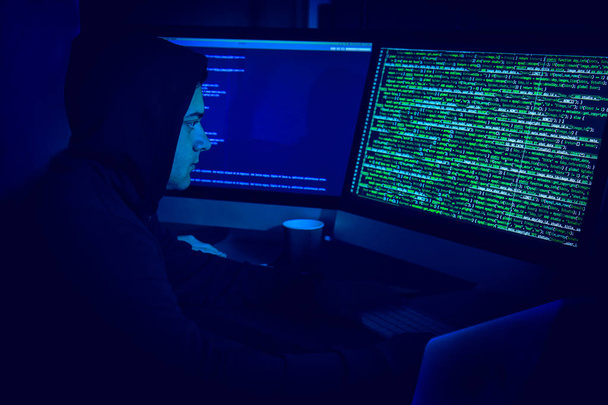 Hacker using computer - Фото, изображение