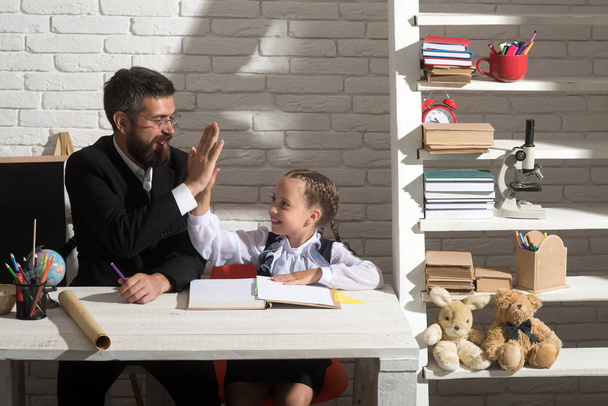 Back to school and fathers day concept. Girl and dad - Foto, afbeelding