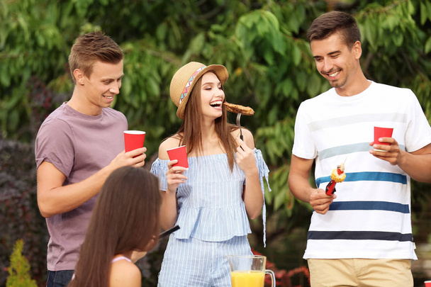 Young friends having barbecue party in garden - Photo, Image