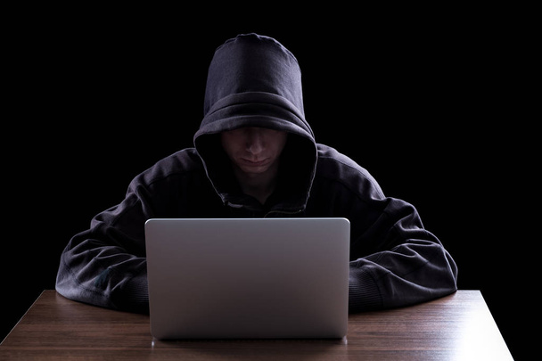 Anonymous hacker in the dark - Zdjęcie, obraz