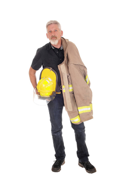 A firefighter with jacket standing from front - Zdjęcie, obraz