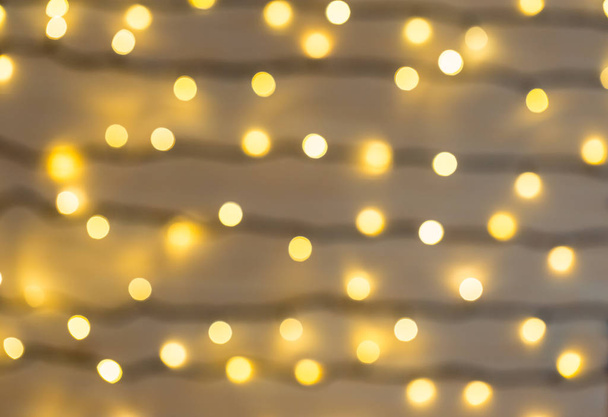Christmas and Happy new year on blurred bokeh with snowfall banner background of a luminous garland - Φωτογραφία, εικόνα