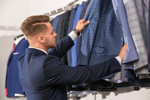 man choosing suit  - Fotó, kép