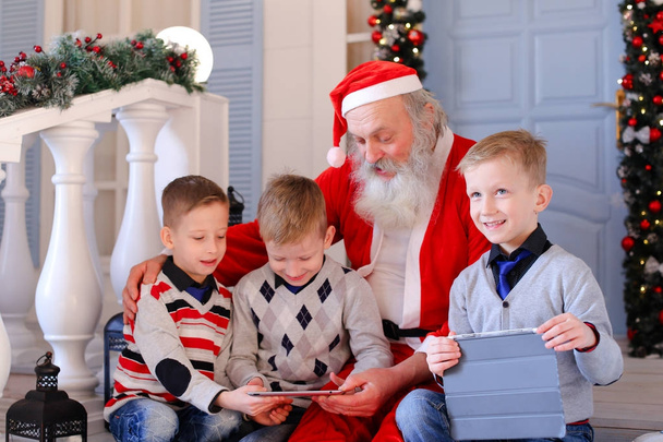 Little boys presented new tablet by Father Christmas. - Photo, Image