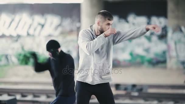 Young men shadow boxing in the street - Footage, Video
