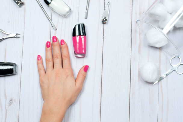 Beautiful female hands with pink nail polish - Valokuva, kuva