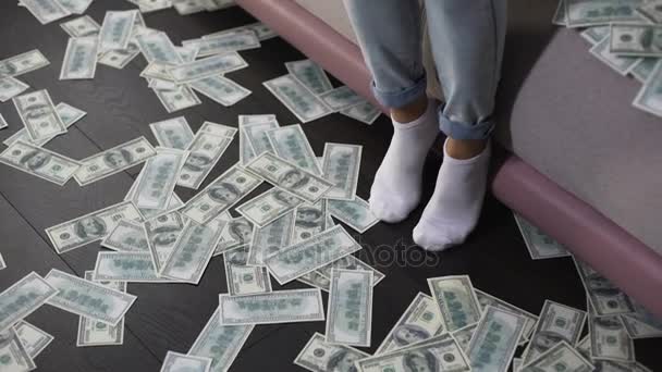 Rich Asian woman sitting on couch and counting money, female billionaire - Imágenes, Vídeo