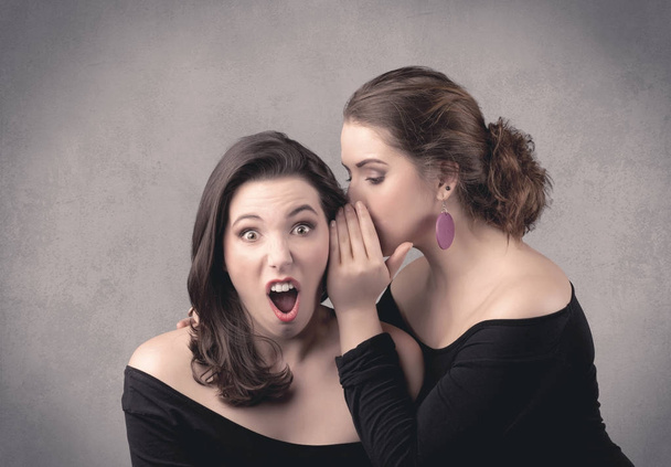 girl telling secret things to her girlfriend - Фото, изображение