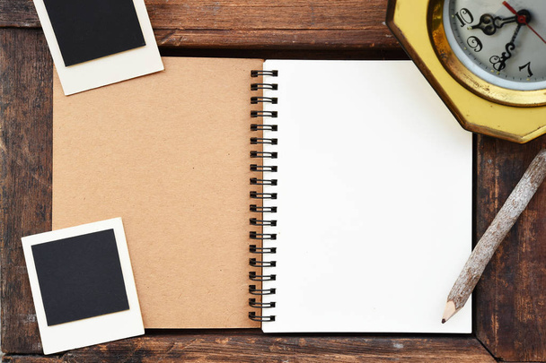 Blank notebook, photo frame, pencil and clock  - Valokuva, kuva