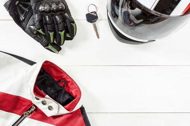 View of motorcycle rider accessories placed on white wooden tabl - Foto, afbeelding