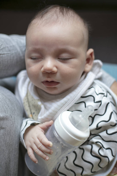 Mother feeding newborn baby from bottle - Fotografie, Obrázek