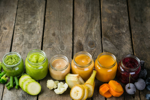 Colorful baby food purees in glass jars - Φωτογραφία, εικόνα