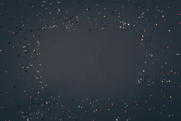 top view of scattered pepper on gray table - Photo, image