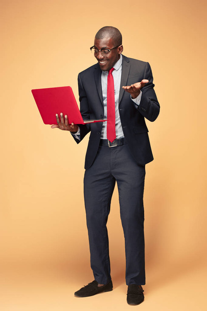 Handsome Afro American man using a laptop - Photo, image