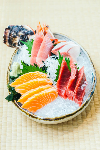 Raw and fresh salmon tuna and other sashimi fish meat - Japanese food style - Photo, Image