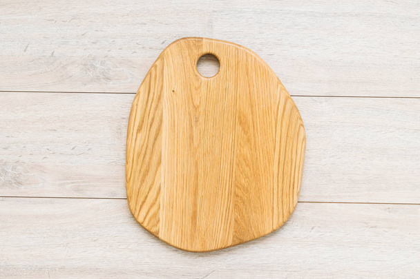 Wood cutting board on wooden background with copy space - Photo, Image